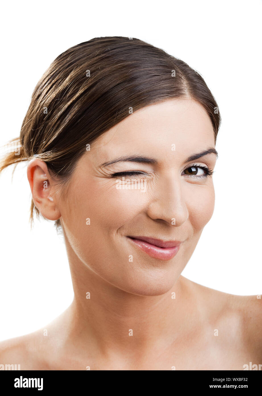 Portrait of a beautiful woman blinking eyes, isolated on white Stock