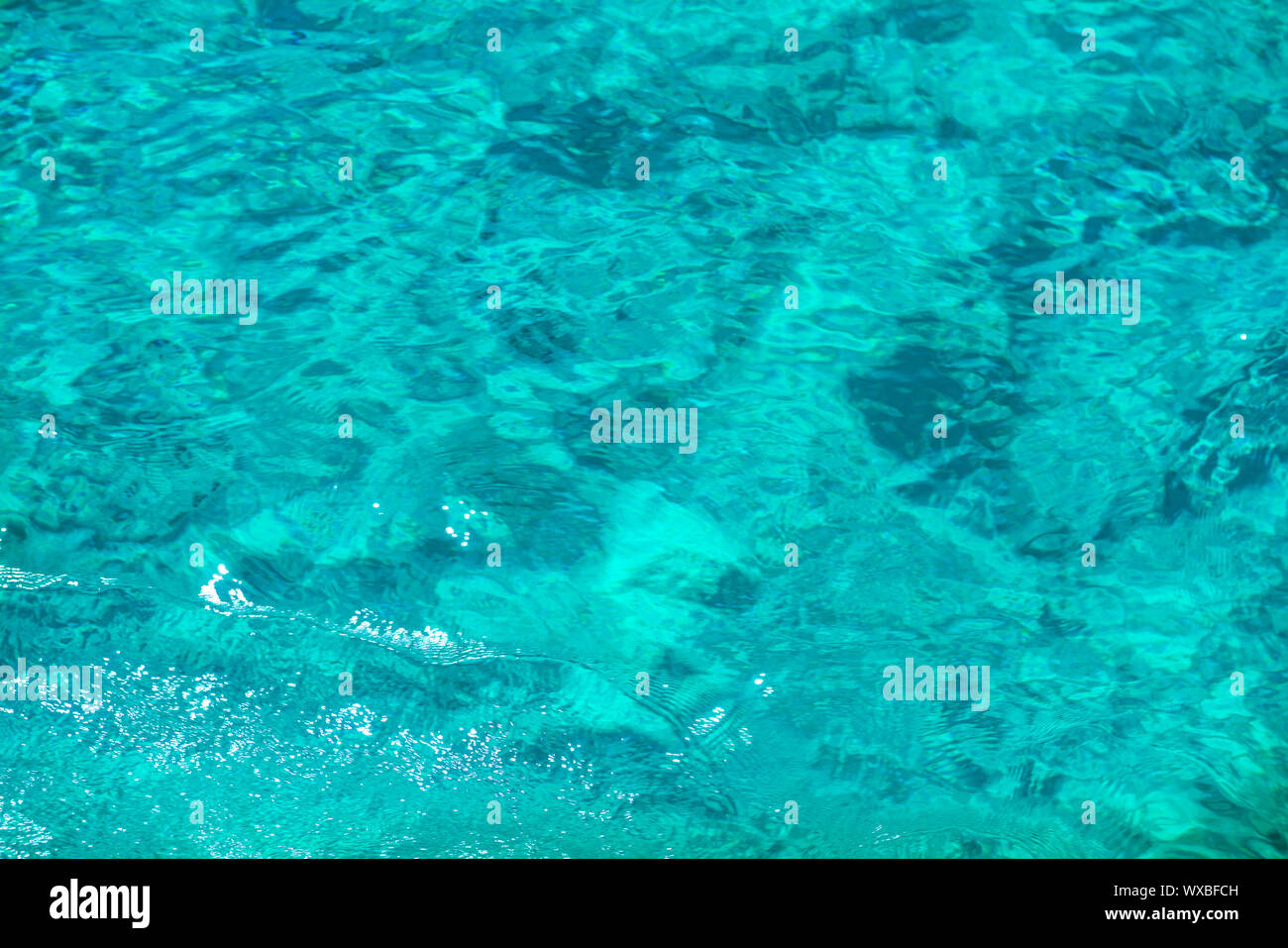 Texture of clear turquoise water surface Stock Photo
