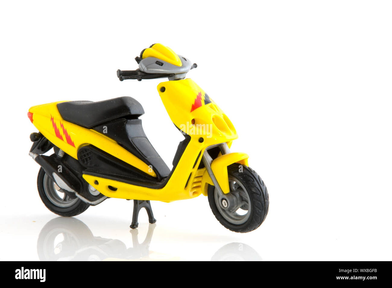Yellow miniature scooter Stock Photo - Alamy