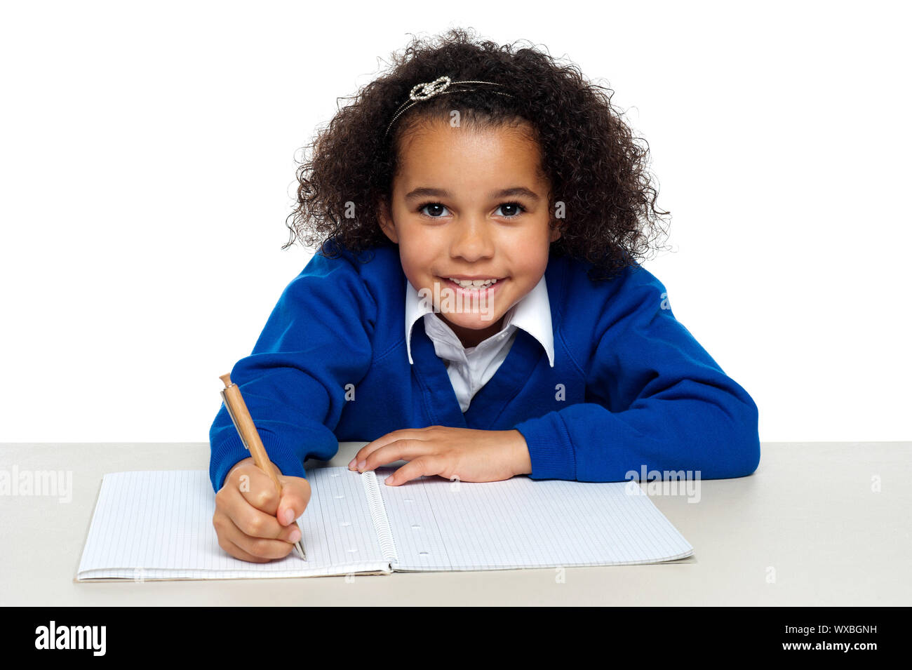 Young girl writing copying notes from the whiteboard. Isolated against ...