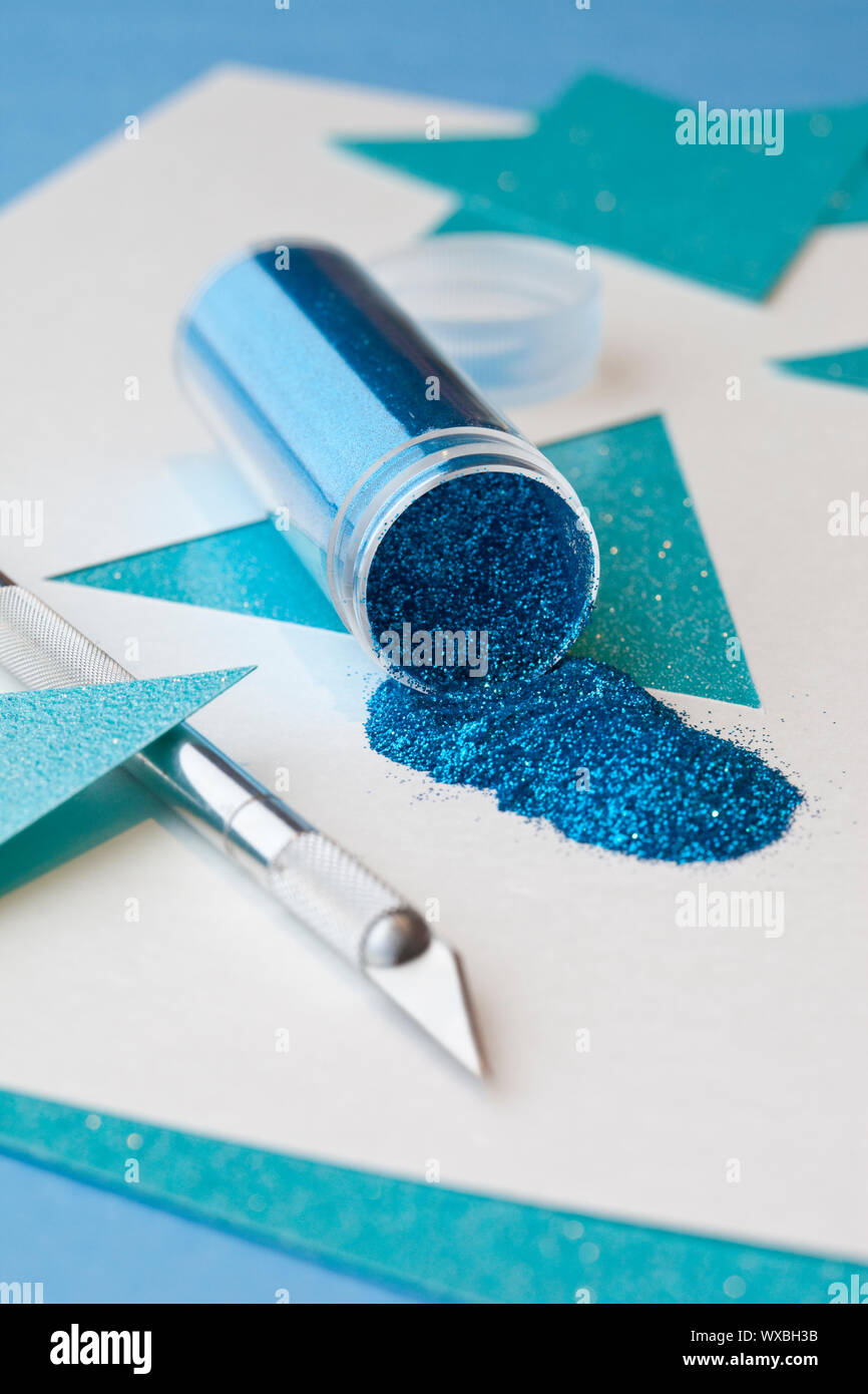 Hanukkah paper crafts using glitter and mat knife supplies making Star of David decorations ornaments Stock Photo