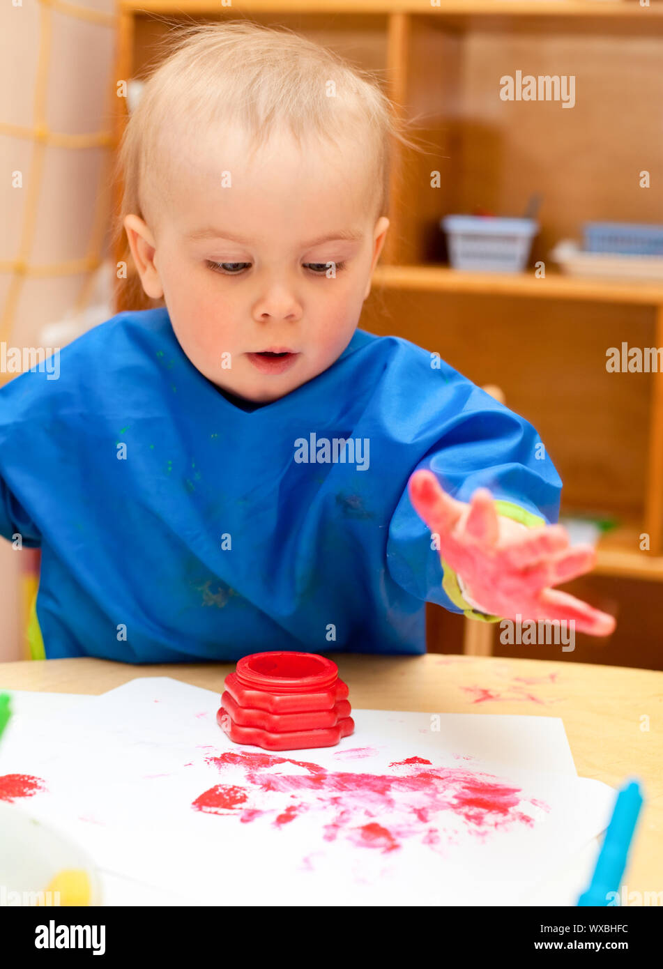 Little girl make finger paint Stock Photo Alamy