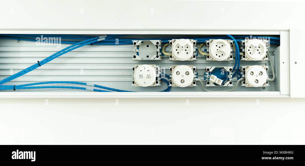 unfinished electrical panel with sockets for cables plugs and wifi