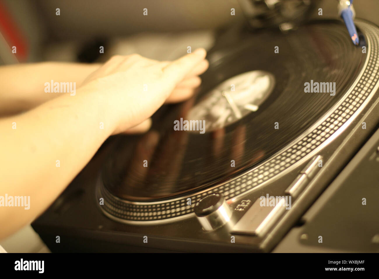 scratch battle of dj playing on his vinyls hand on Stock Photo Alamy