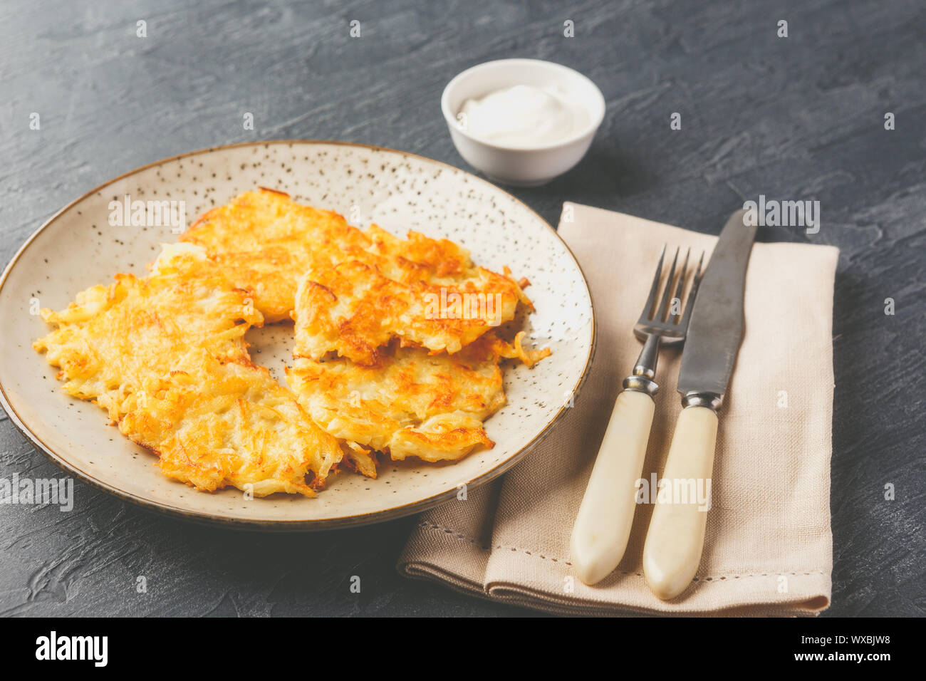 Panfried potato pancakes rosti, kartoffelpuffer, latkes, draniki