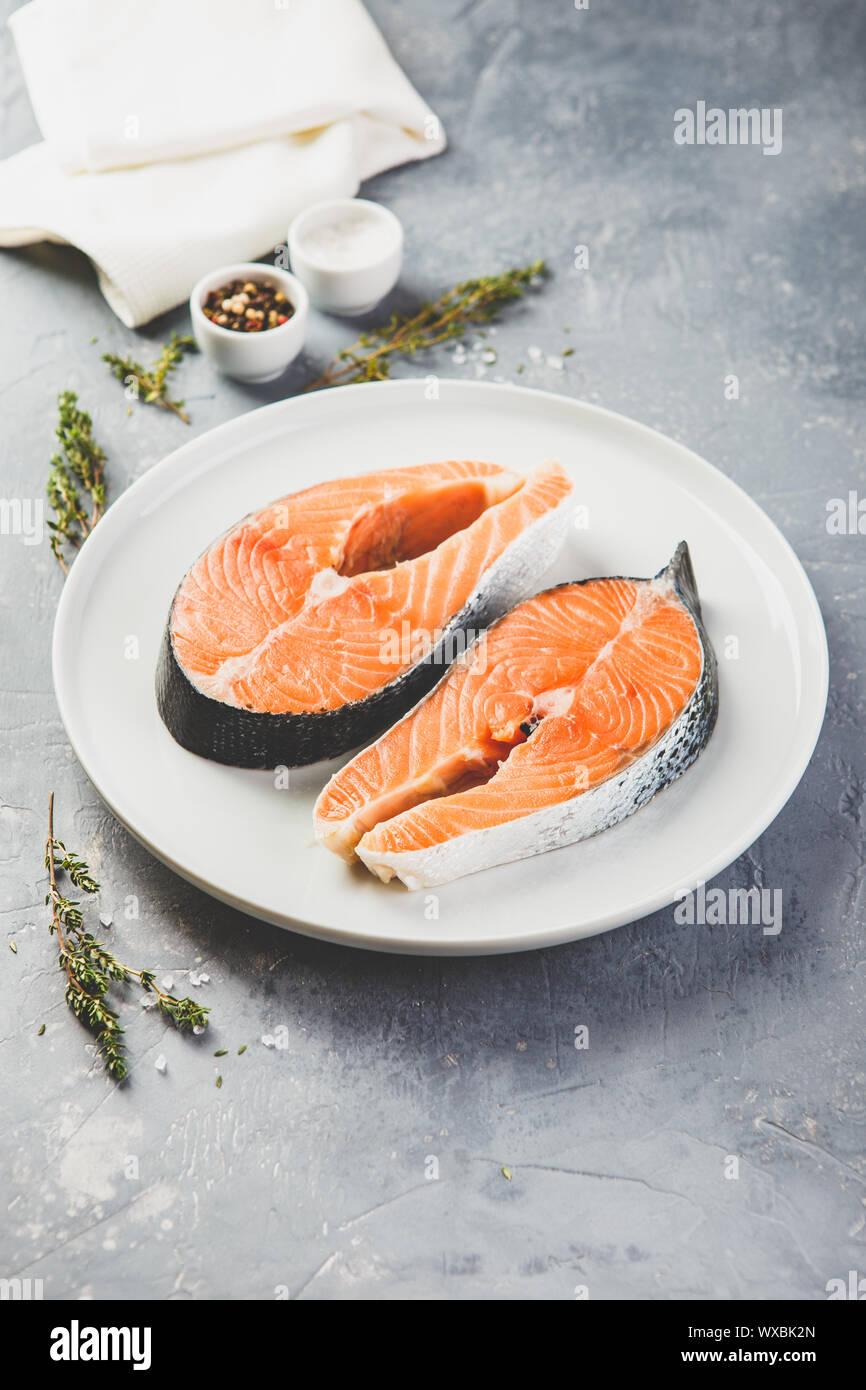 Two fresh raw salmon steaks Stock Photo - Alamy