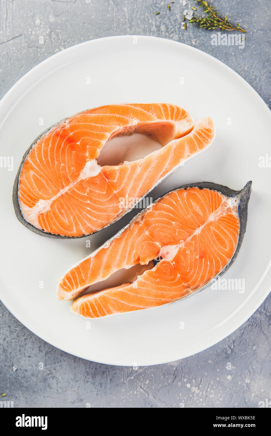 Two fresh raw salmon steaks Stock Photo - Alamy