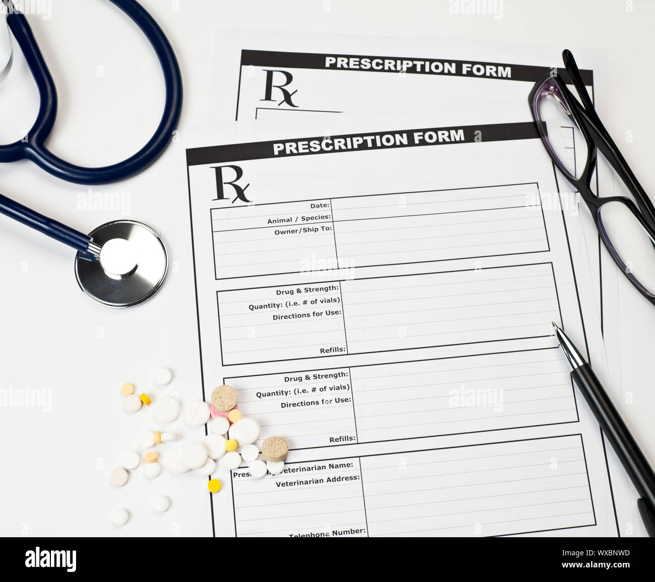 Blank veterinarian prescription form with stethoscope pills glasses and ...