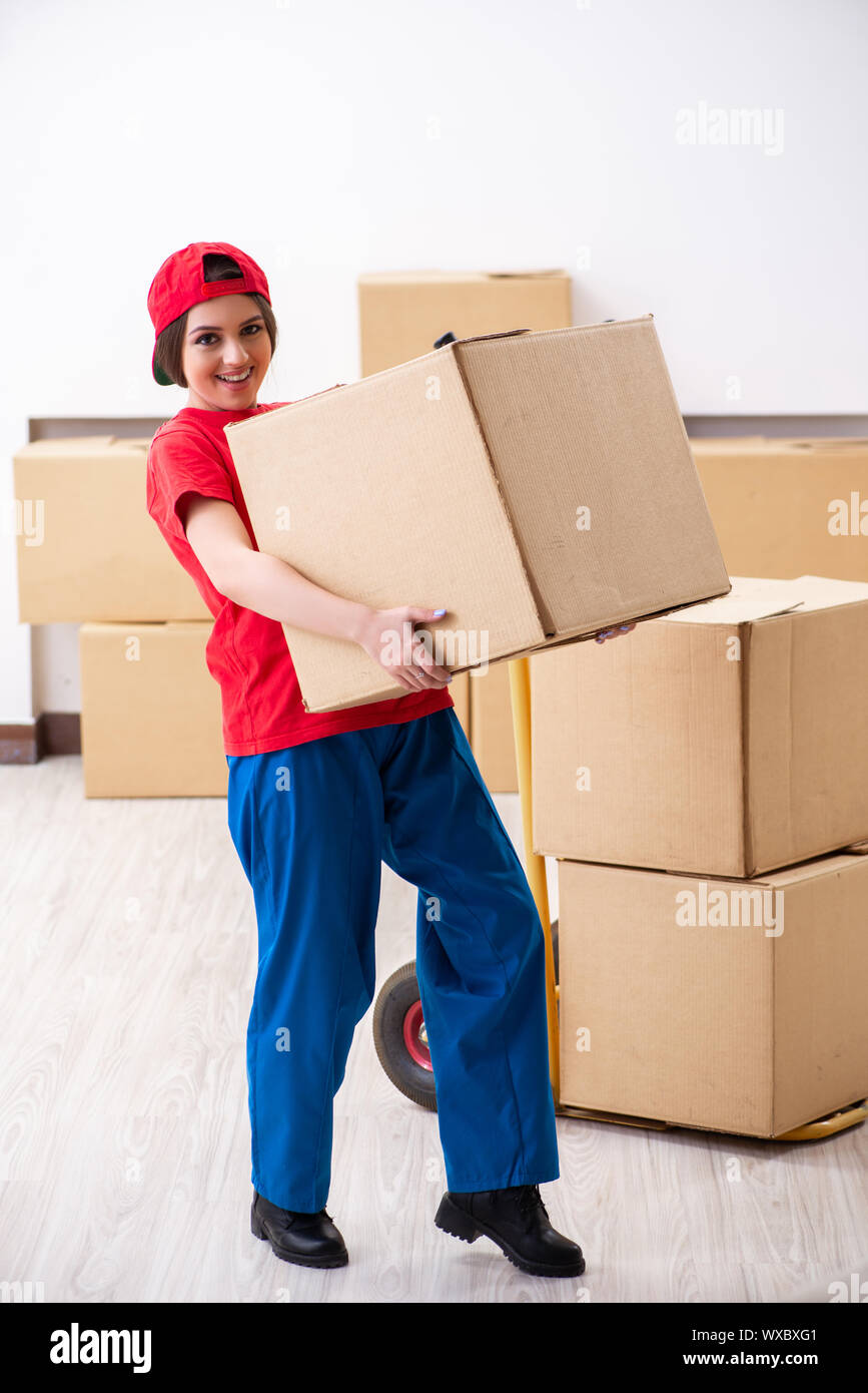 Young female professional mover doing home relocation Stock Photo