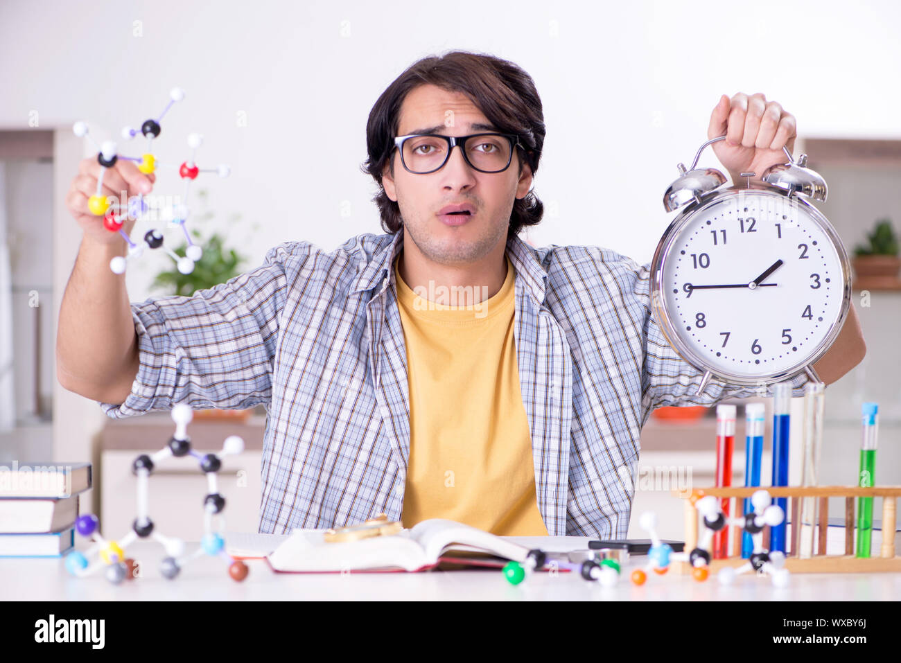 Young student physicist preparing for exam at home Stock Photo Alamy