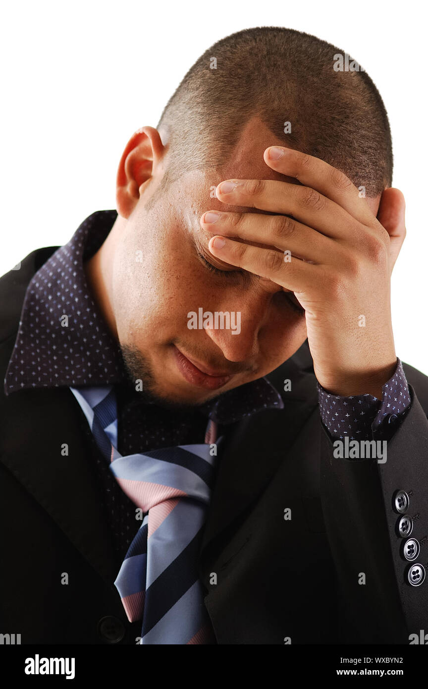 This is an image of a businessman with his hands to his head. Stock Photo