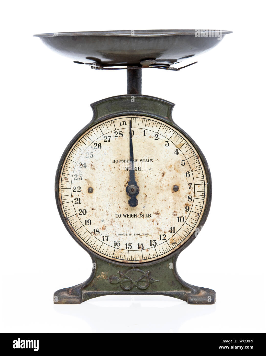 old metal scales on white studio backdrop Stock Photo - Alamy