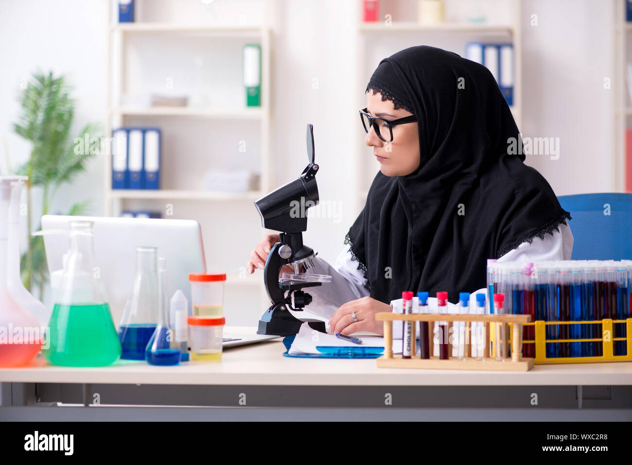 Female chemist in hijab working in the lab Stock Photo - Alamy