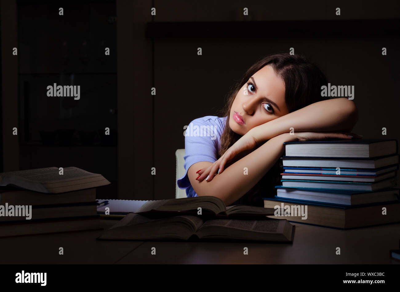 Young female student preparing for exams late at home Stock Photo - Alamy