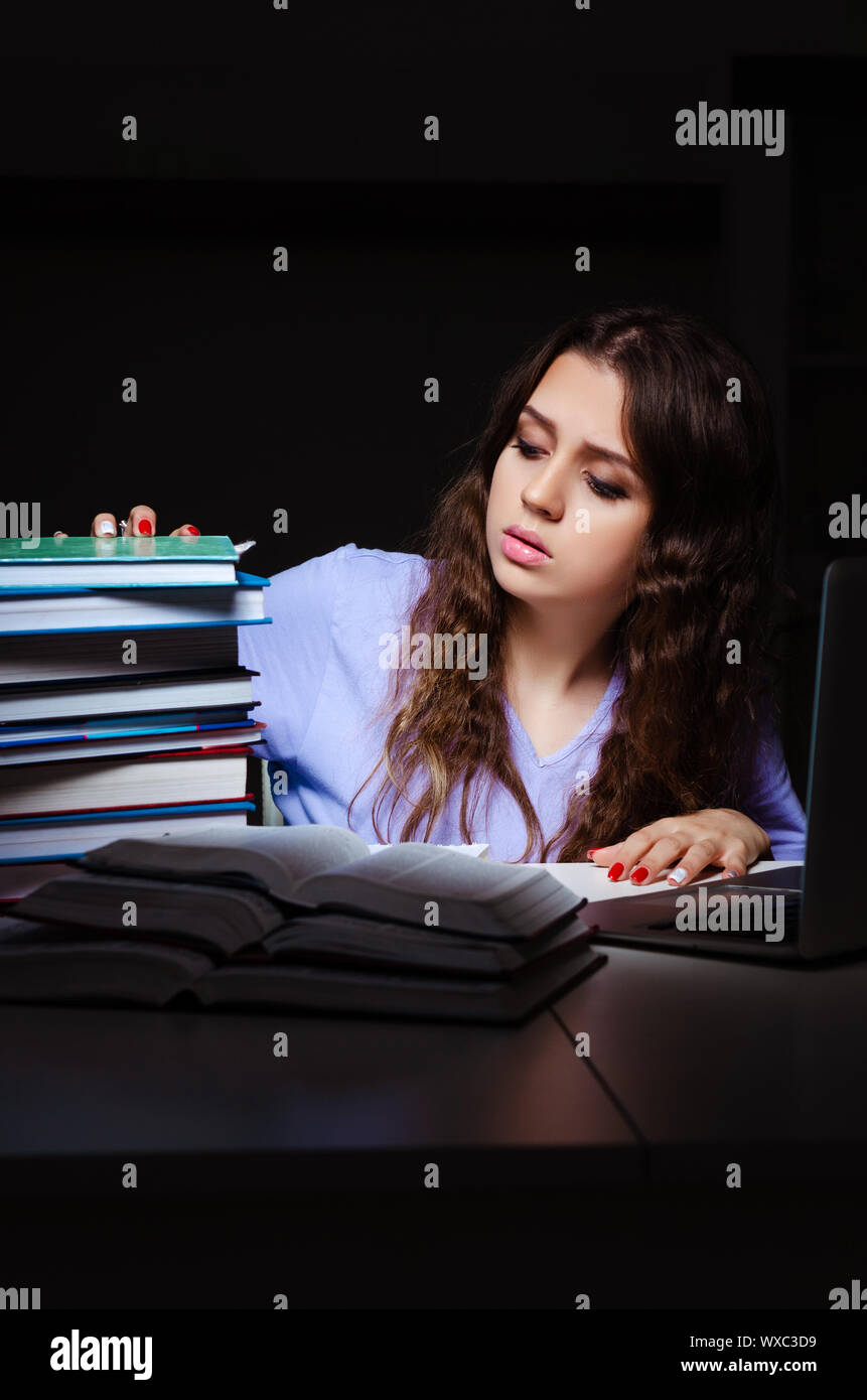 Young female student preparing for exams late at home Stock Photo - Alamy