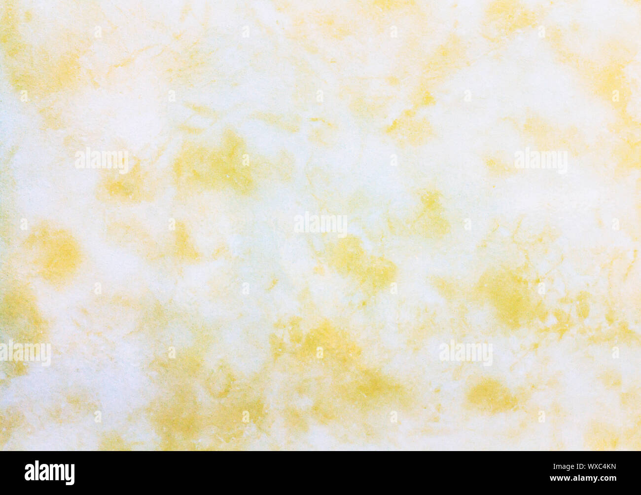 Close up golden marble texture background, yellow and white marble