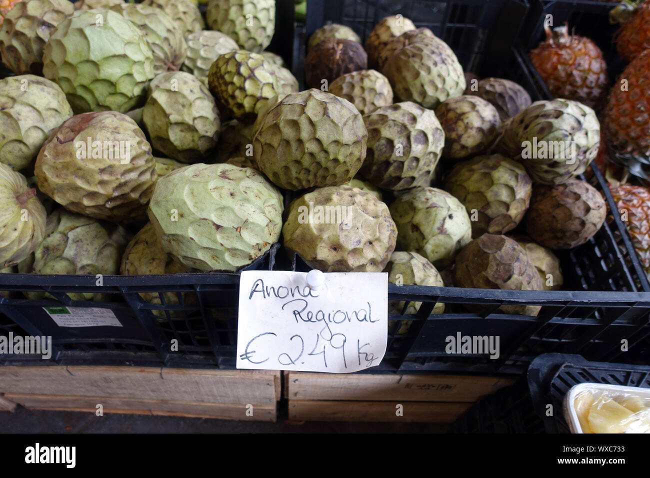 Market hall with regional vegetables and fruit - Cherimoya (Annona cherimola) Stock Photo