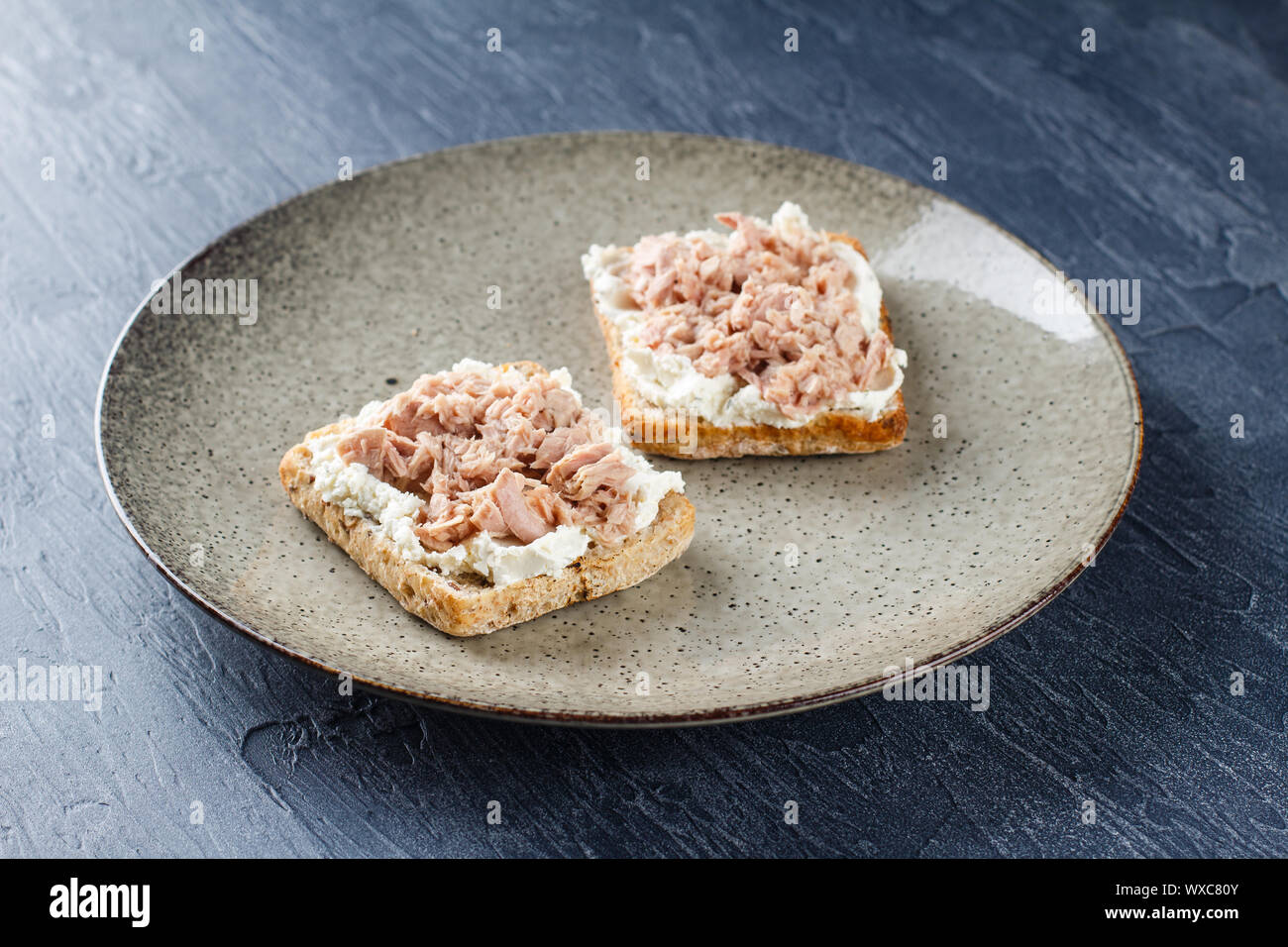 Delicious tuna sandwich, served with radish and cucumber Stock Photo