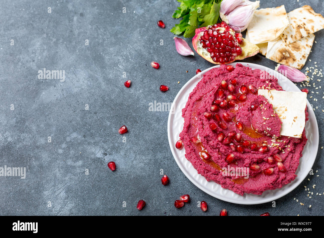 Beet hummus dip with pita bread Stock Photo Alamy