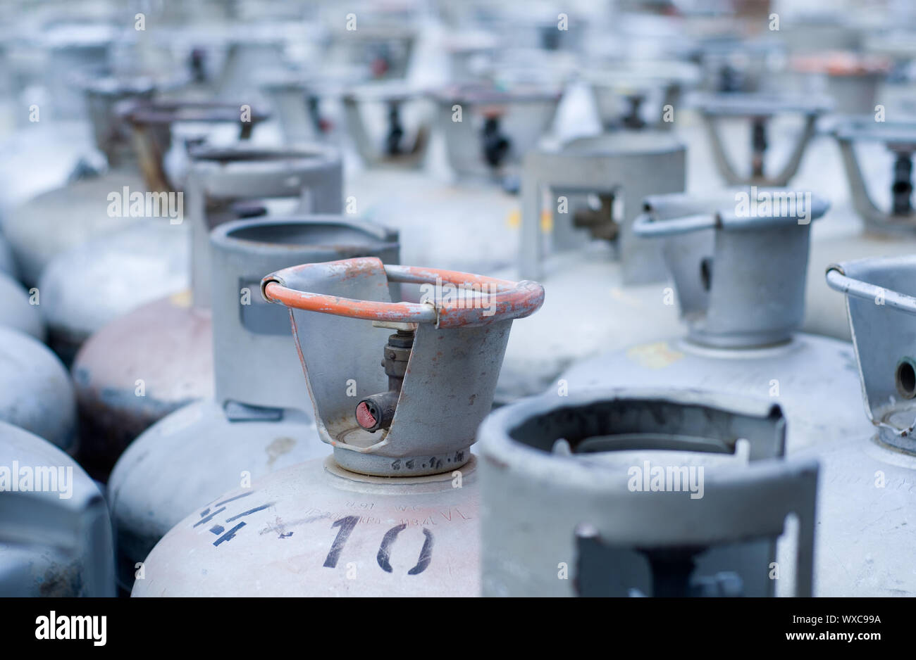 Metal LPG gas bottles in storage Stock Photo Alamy