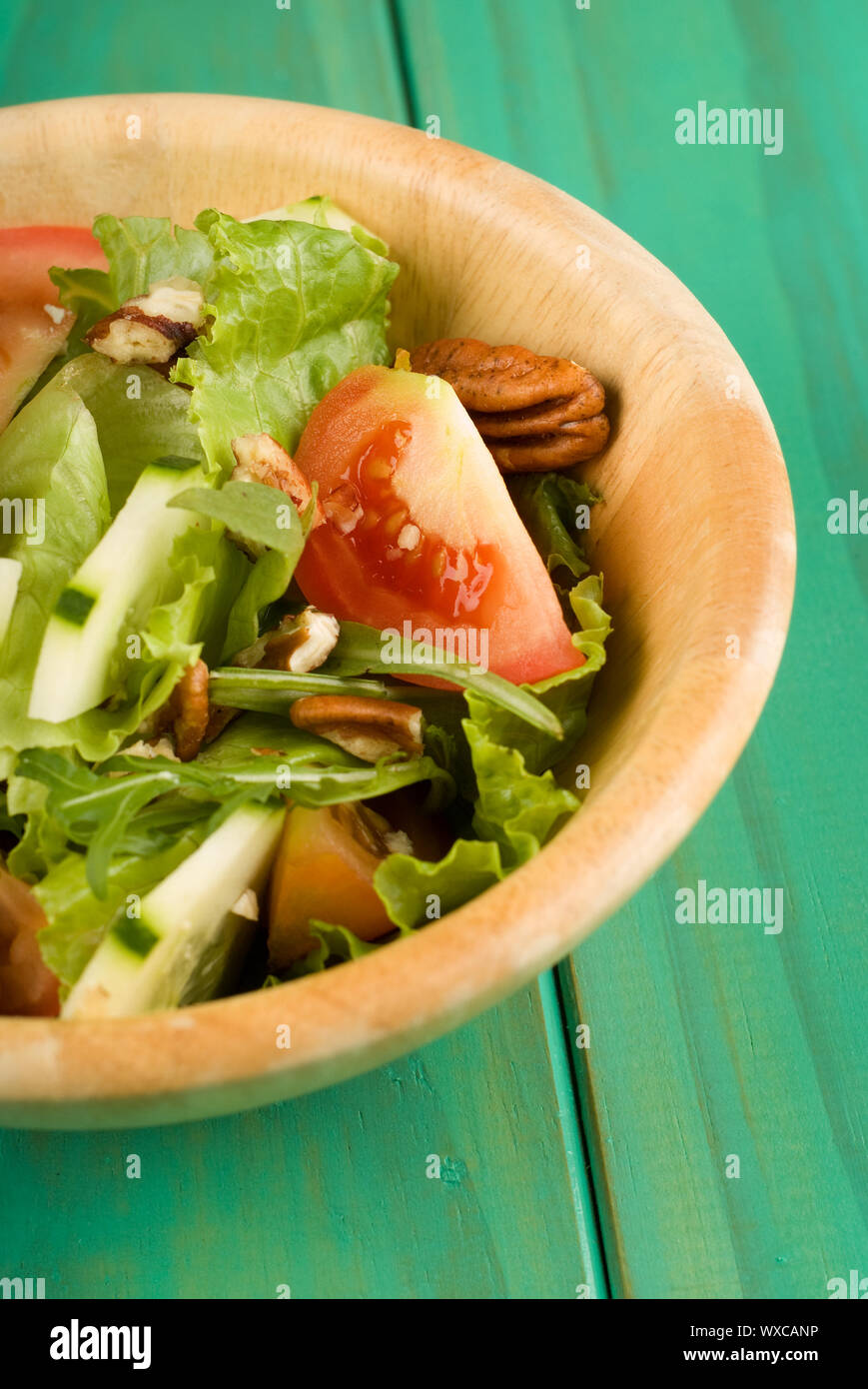 Healthy fresh green salad in wooden bowl Stock Photo - Alamy