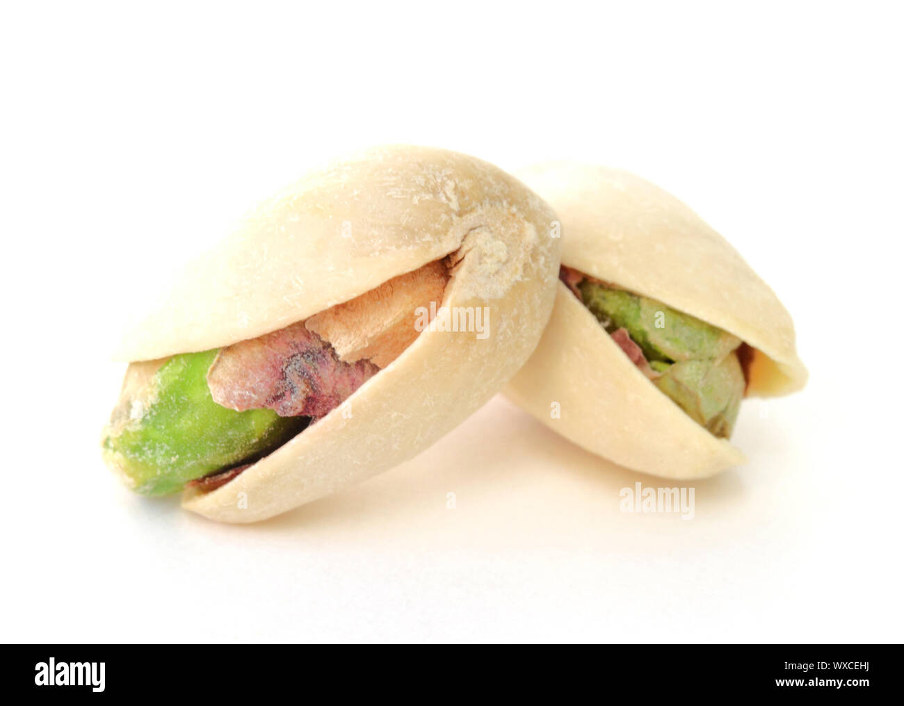Two pistachios isolated on white background Stock Photo Alamy