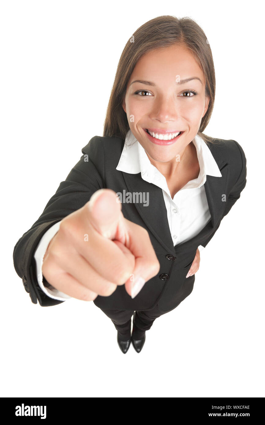 Woman pointing at camera that is above in high angle view. Wide angle