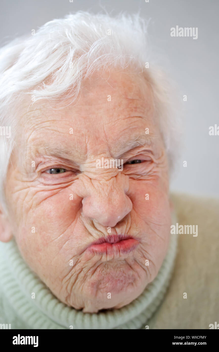 Close up image of senior woman grimacing Stock Photo