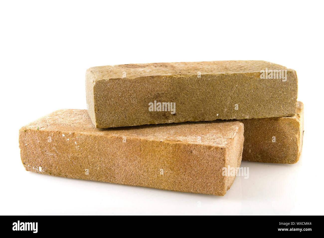 Three bricks stacked and isolated over white Stock Photo