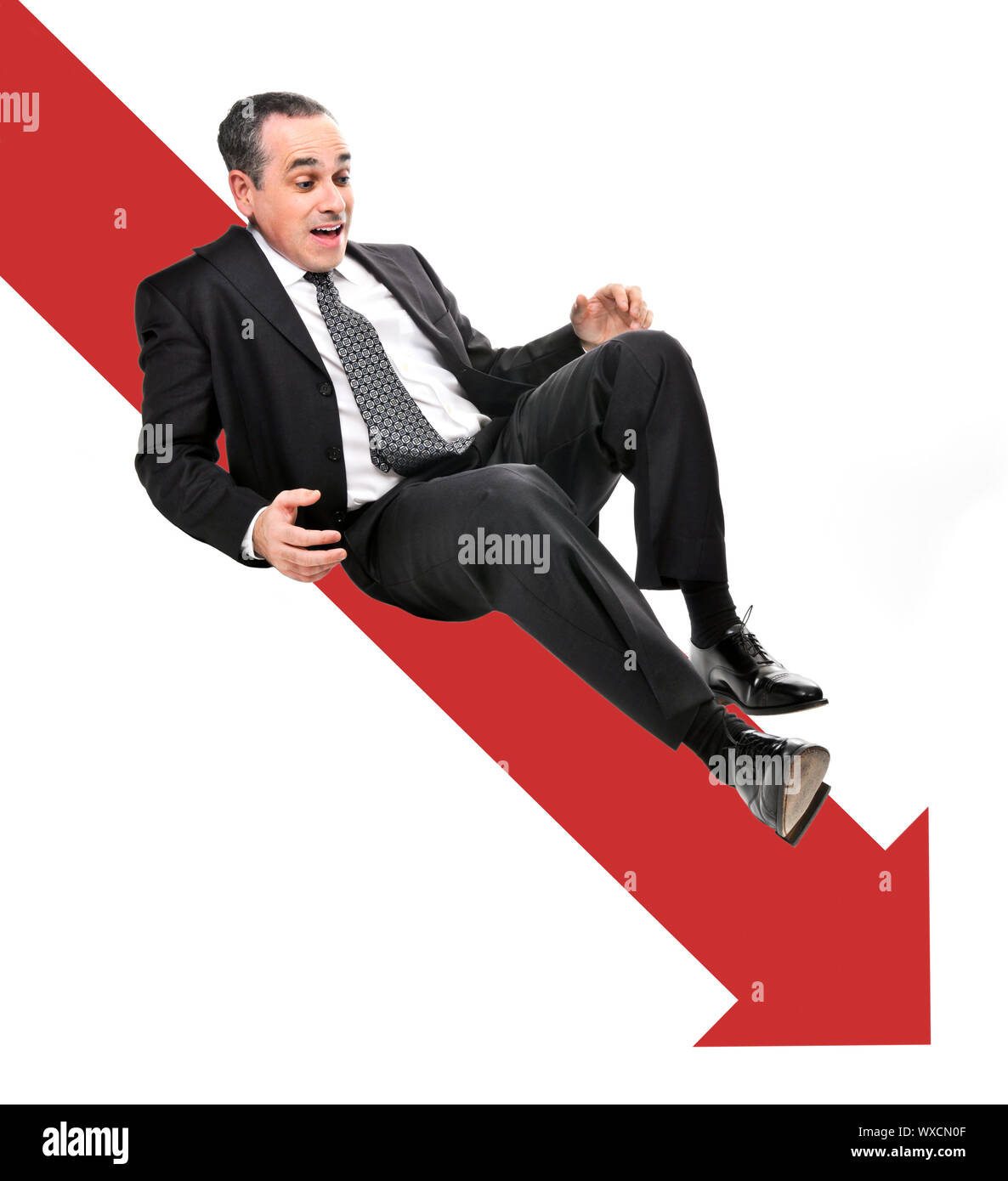 Businessman sliding down red arrow in financial crisis Stock Photo - Alamy