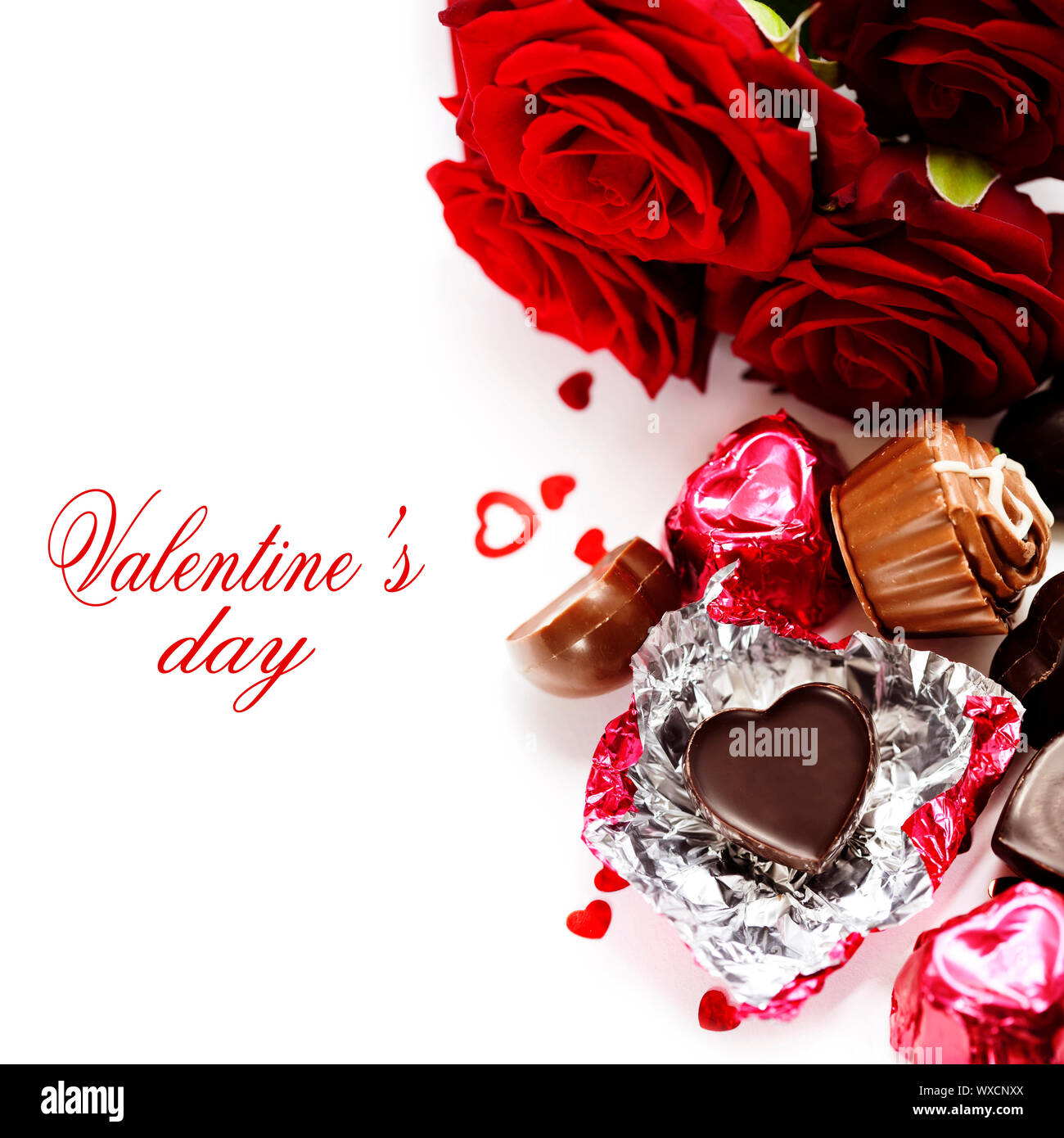red roses and chocolate hearts for Valentine's Day (with sample text Stock  Photo - Alamy