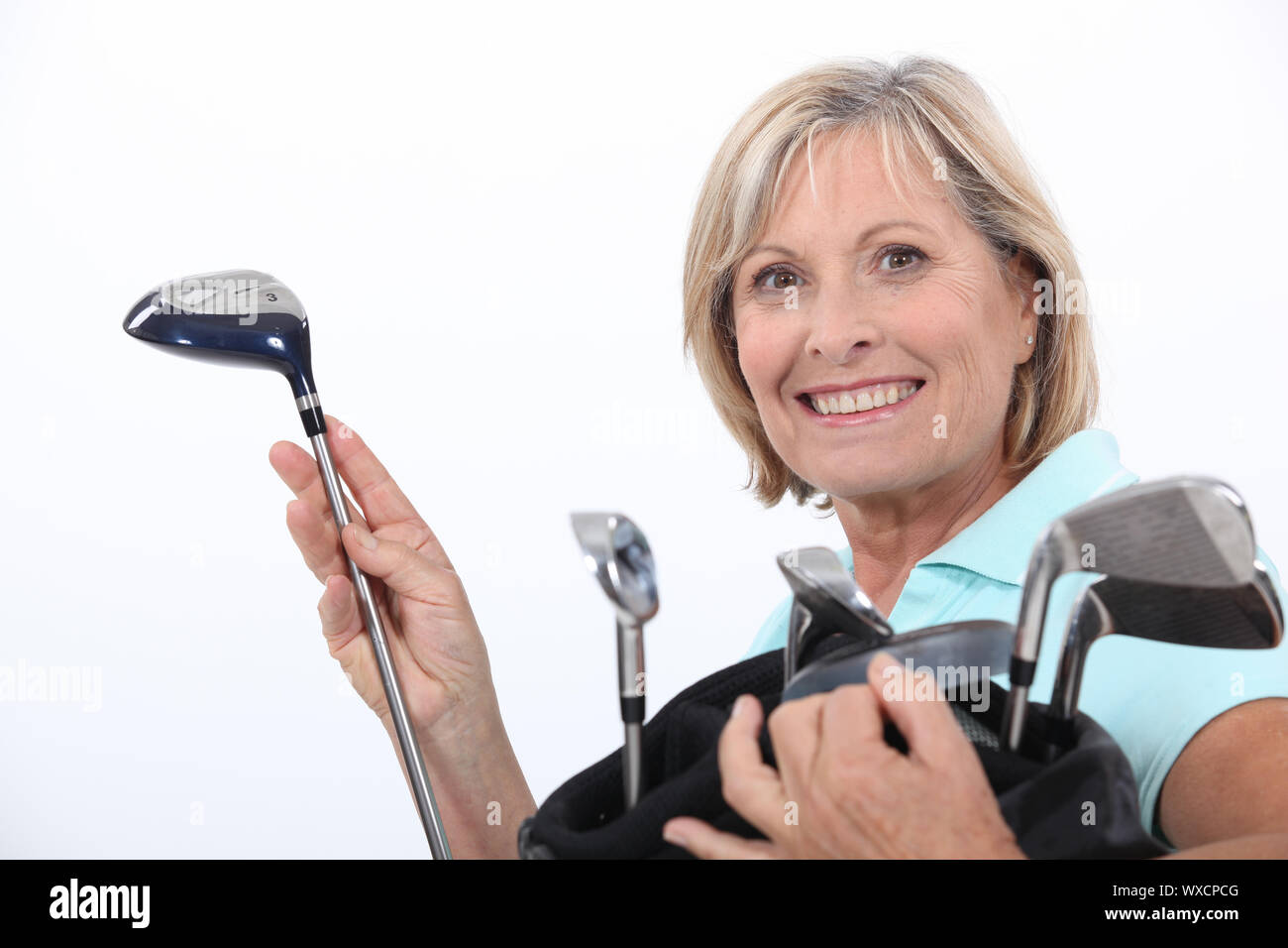 Woman with golf bag Stock Photo Alamy