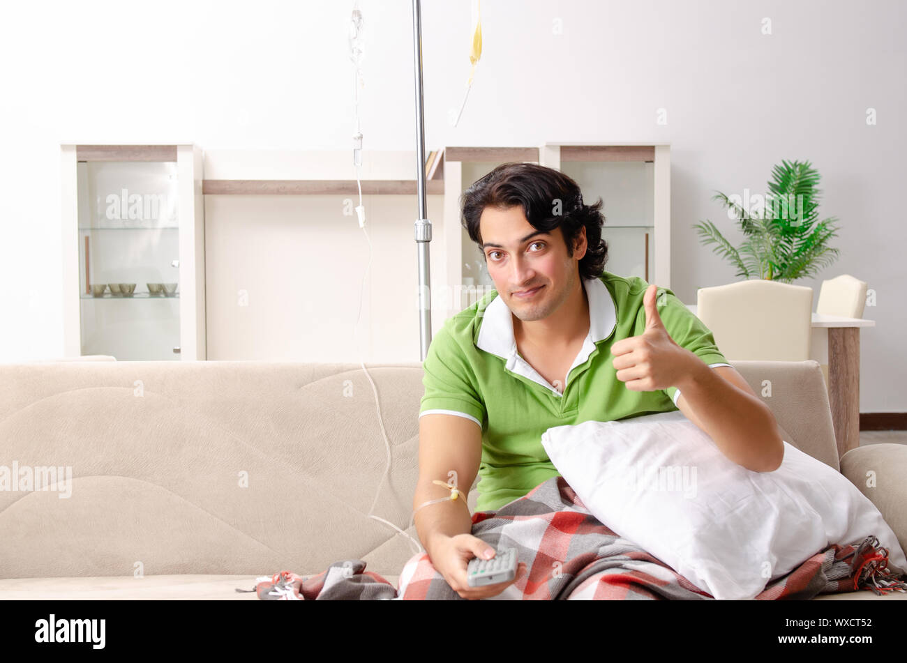 Young man suffering at home Stock Photo