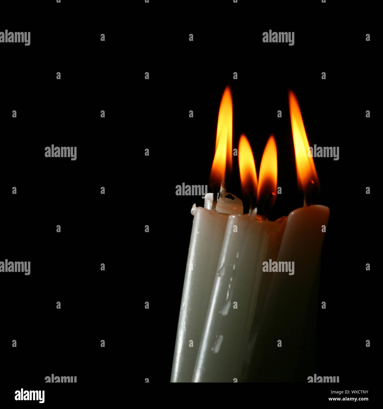 sacred candles in dark on black background Stock Photo Alamy
