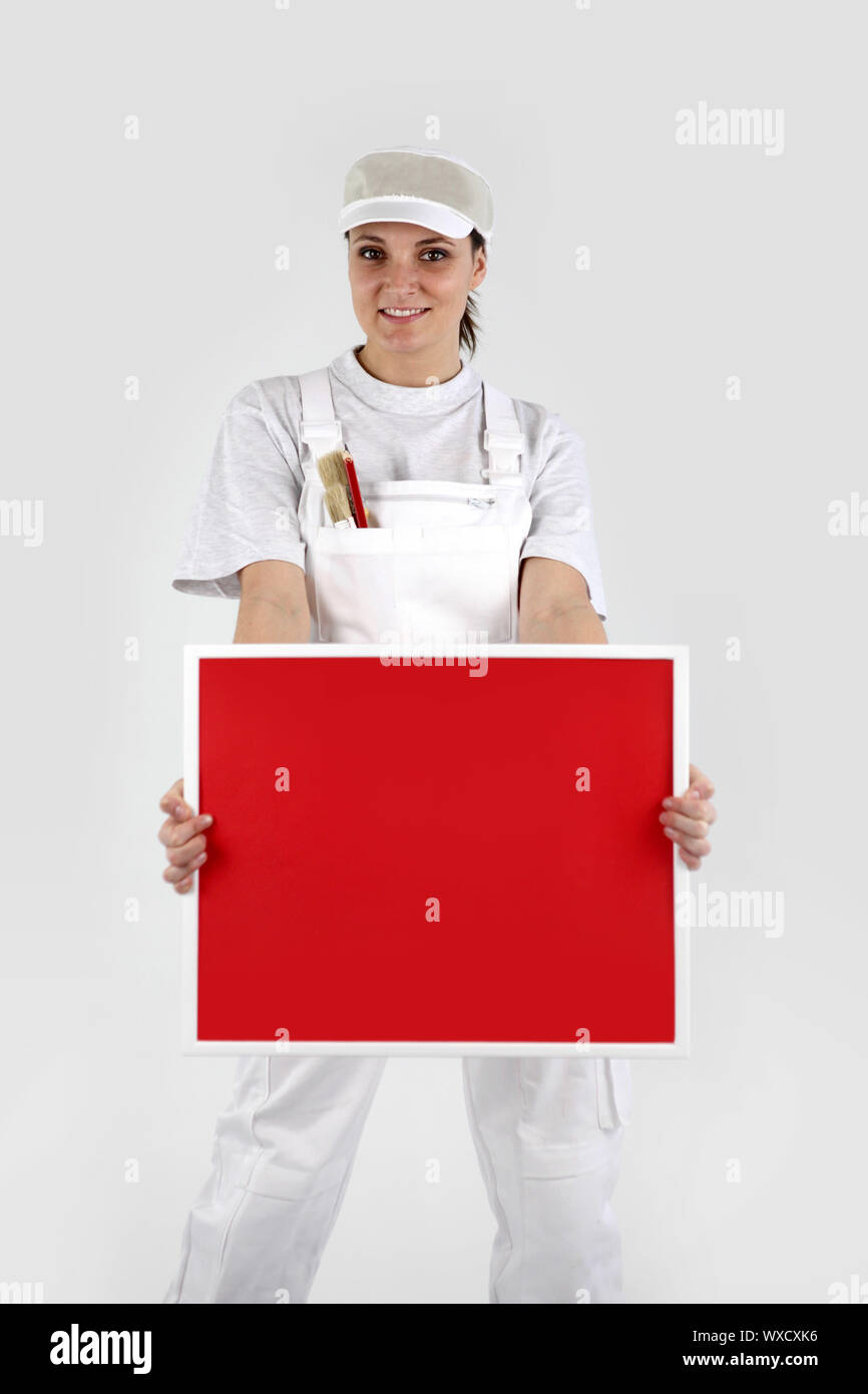 Painter holding up a red sign Stock Photo