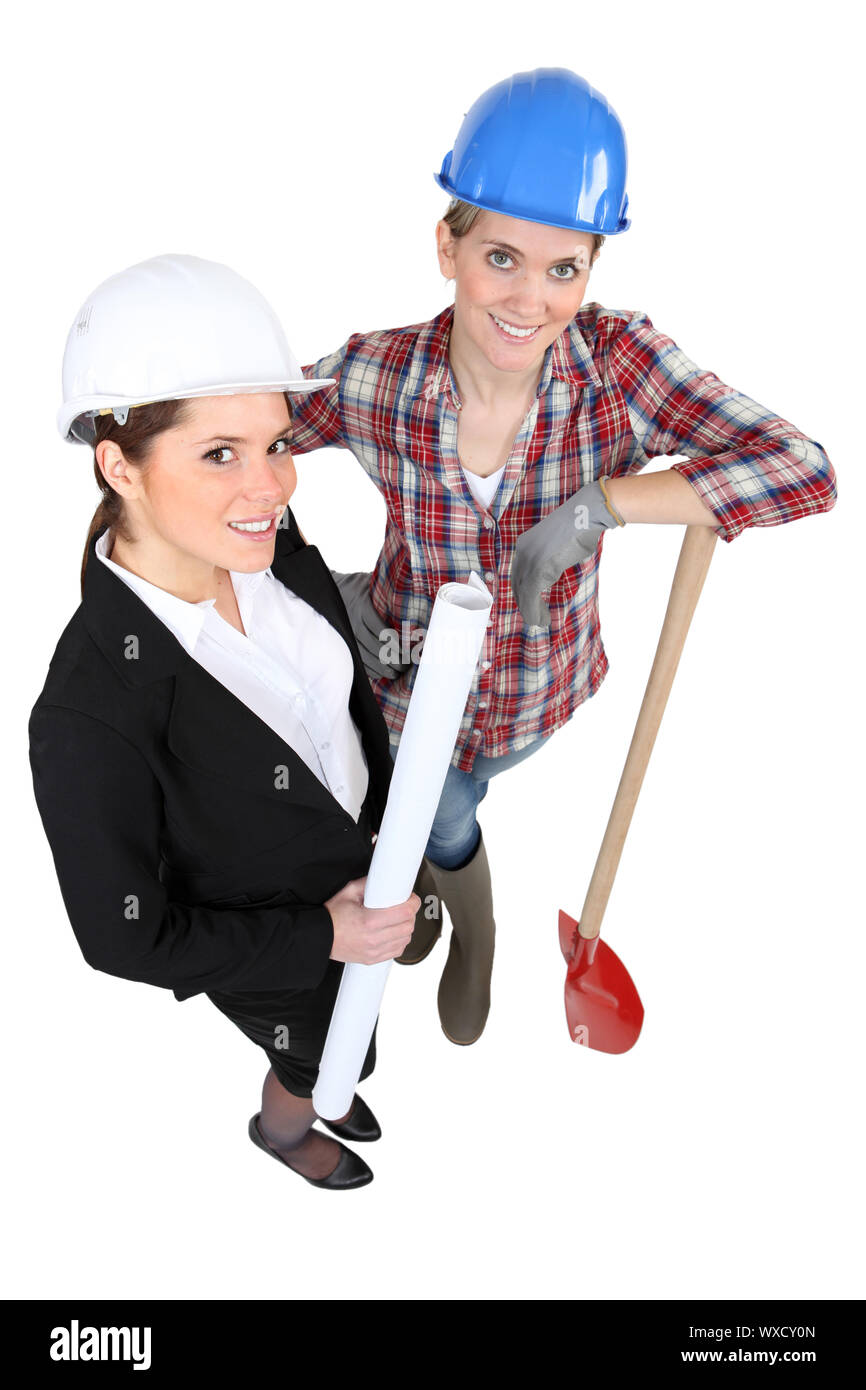 Blue collar worker standing next to an engineer Stock Photo Alamy
