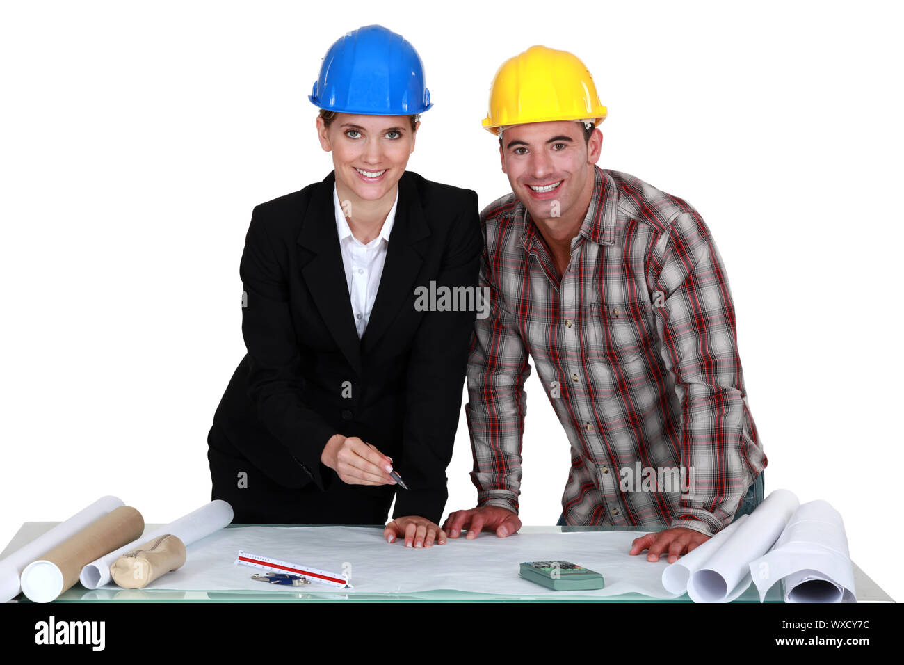 Architect and builder looking at plans Stock Photo