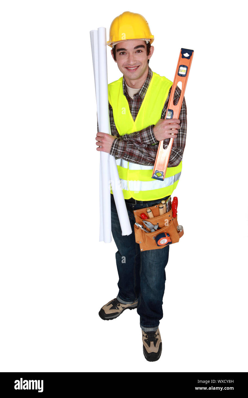 craftsman holding a level and a blueprint Stock Photo - Alamy