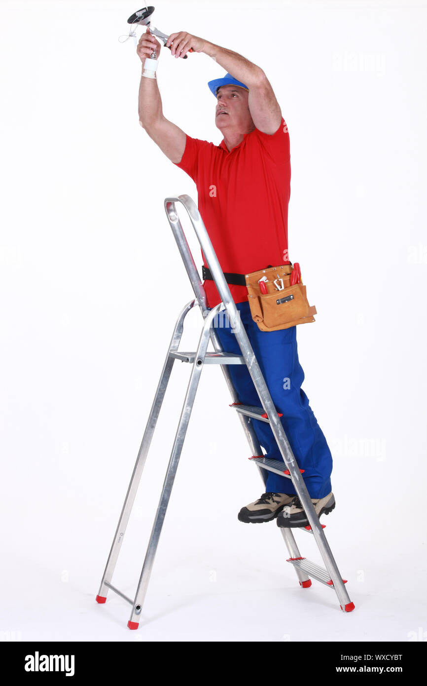 Electrician on a ladder Stock Photo Alamy