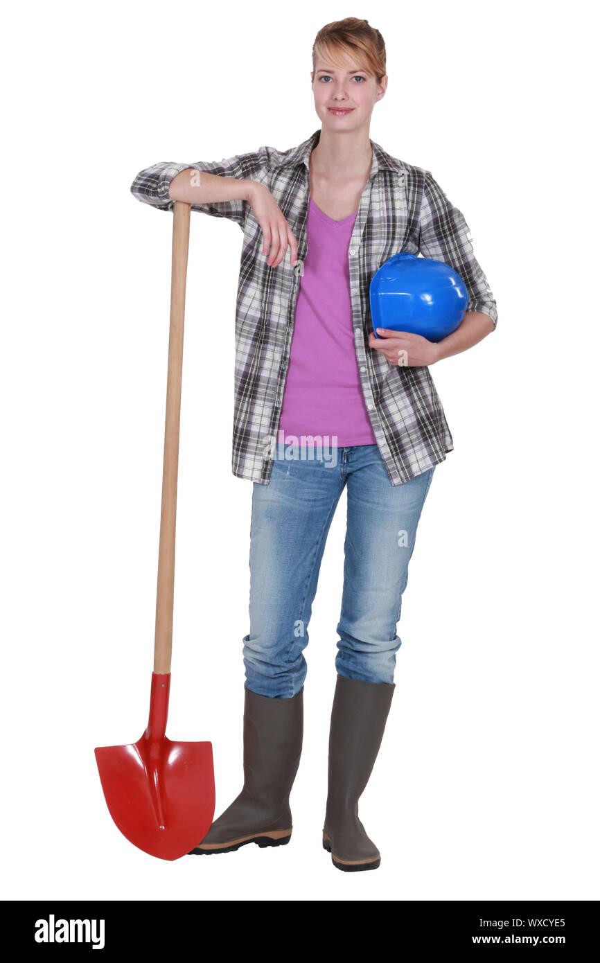 Potrait of a tradeswoman with her shovel Stock Photo