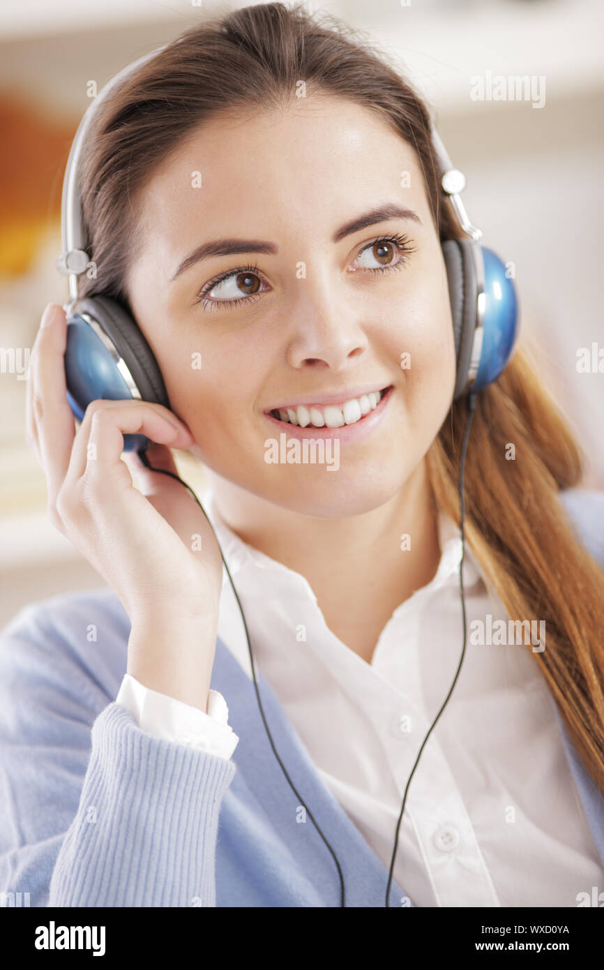 Woman wearing headphones, listening to music Stock Photo Alamy