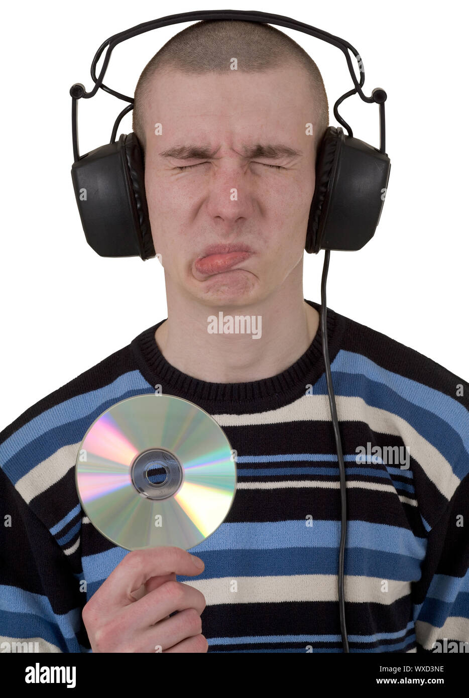 Man in phones and compact disk in hand on white background Stock Photo