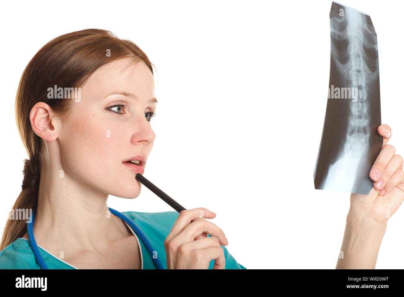 Young female doctor looking at the xray picture Stock Photo - Alamy
