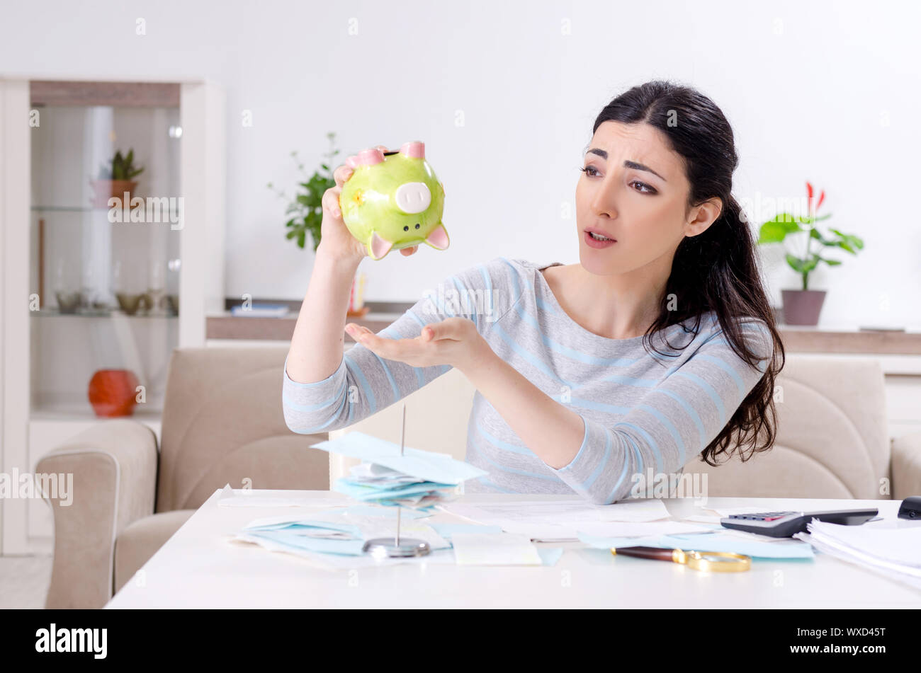 Young woman in budget planning concept Stock Photo