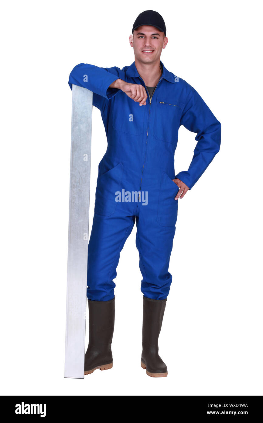 Worker in blue overalls Stock Photo