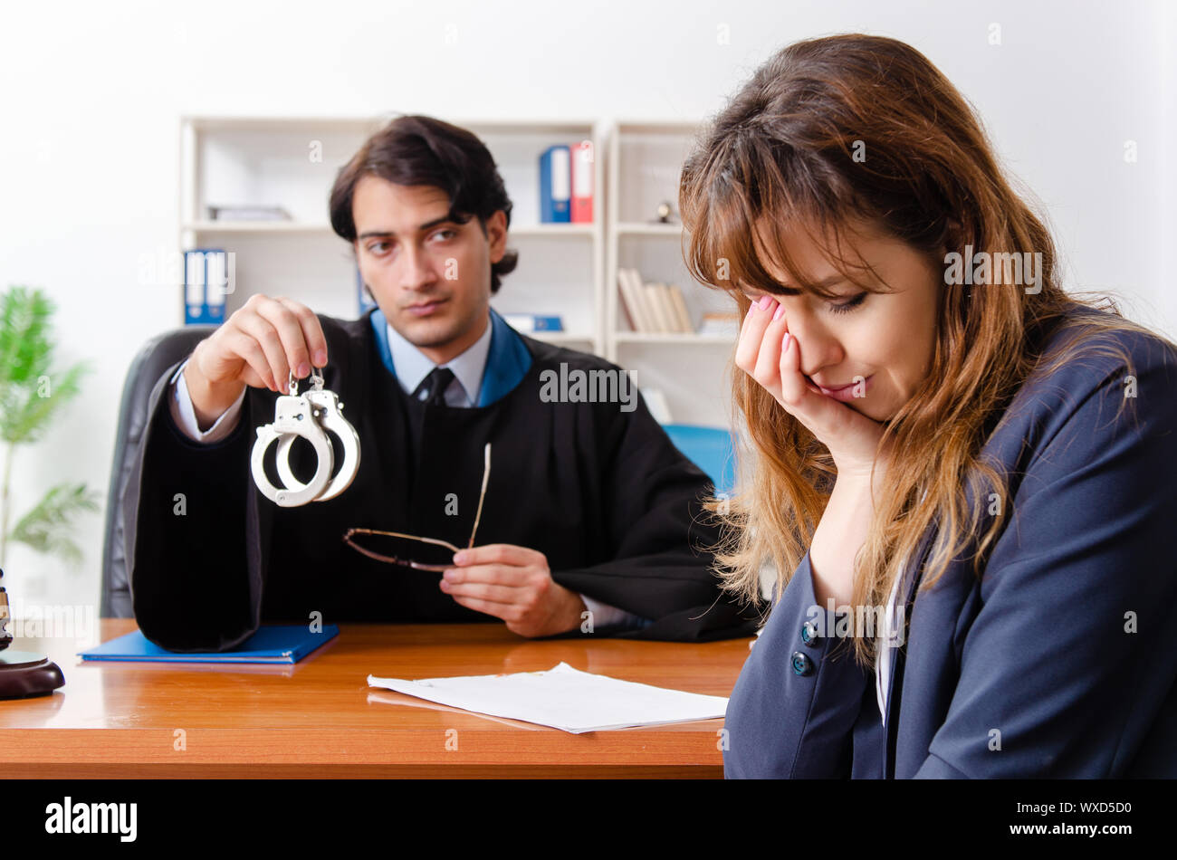 Young woman visiting male lawyer Stock Photo