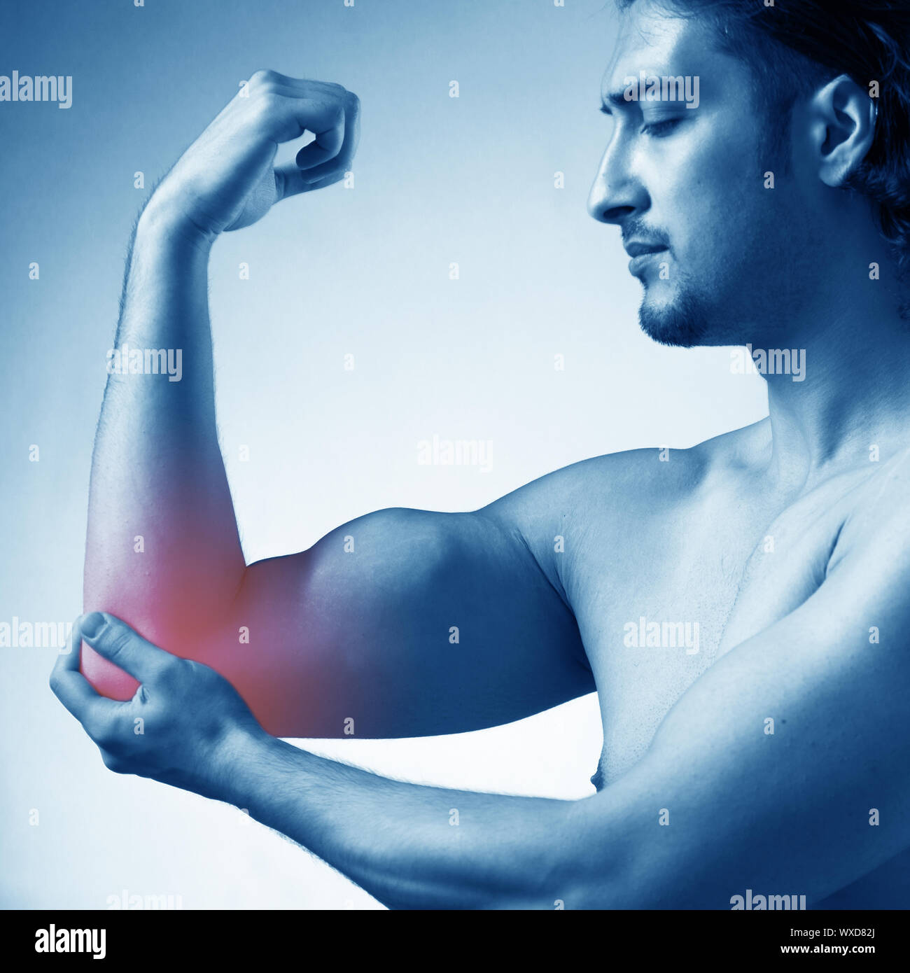 Man suffering from acute pain in elbow Stock Photo Alamy