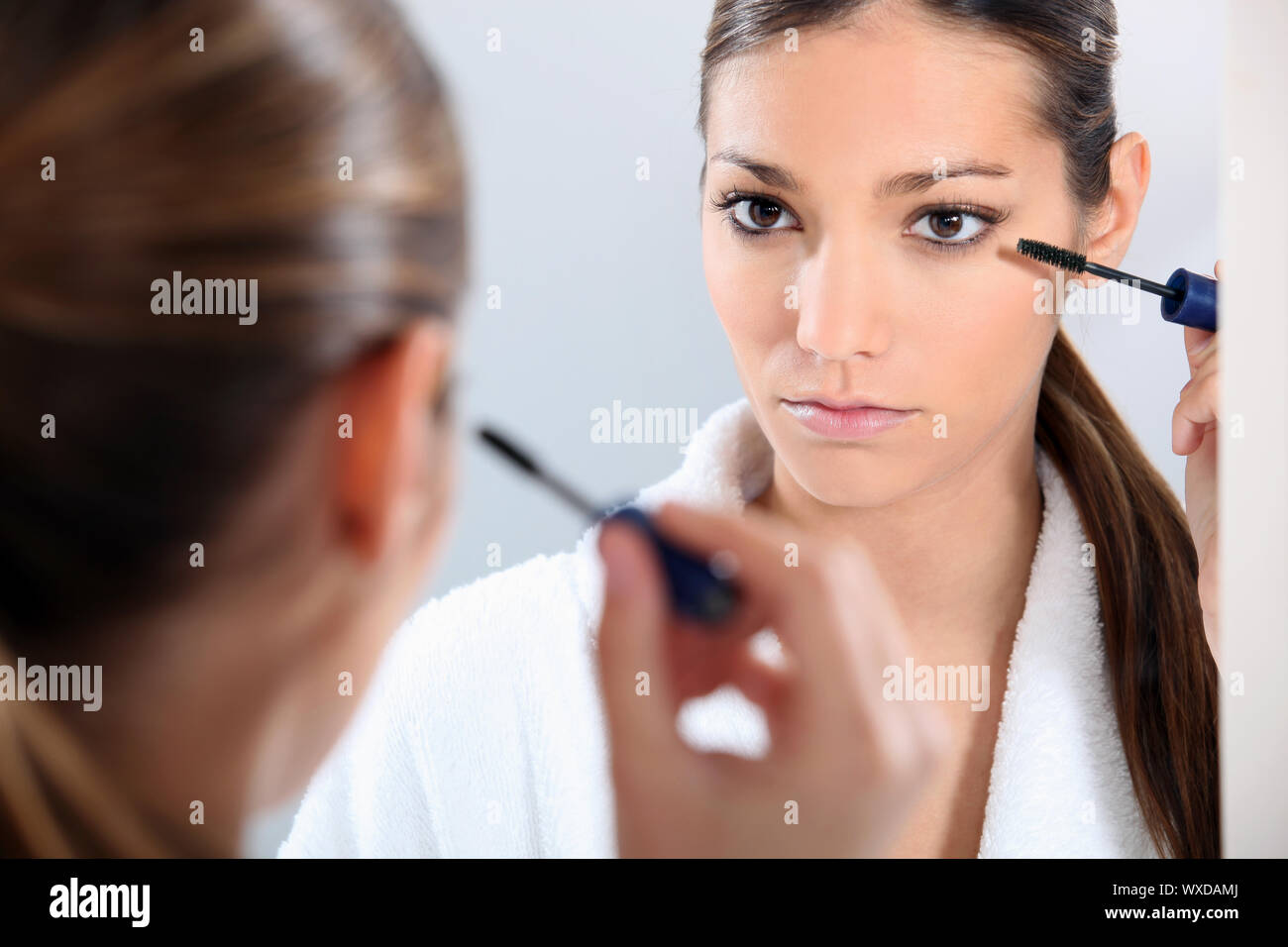 Young woman using eyebrow brush hi-res stock photography and images - Alamy