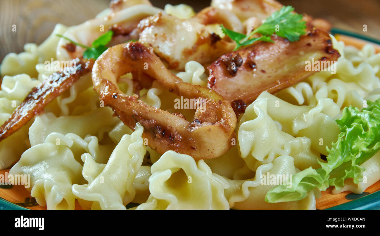 Pasta Campanelle con calamari Stock Photo