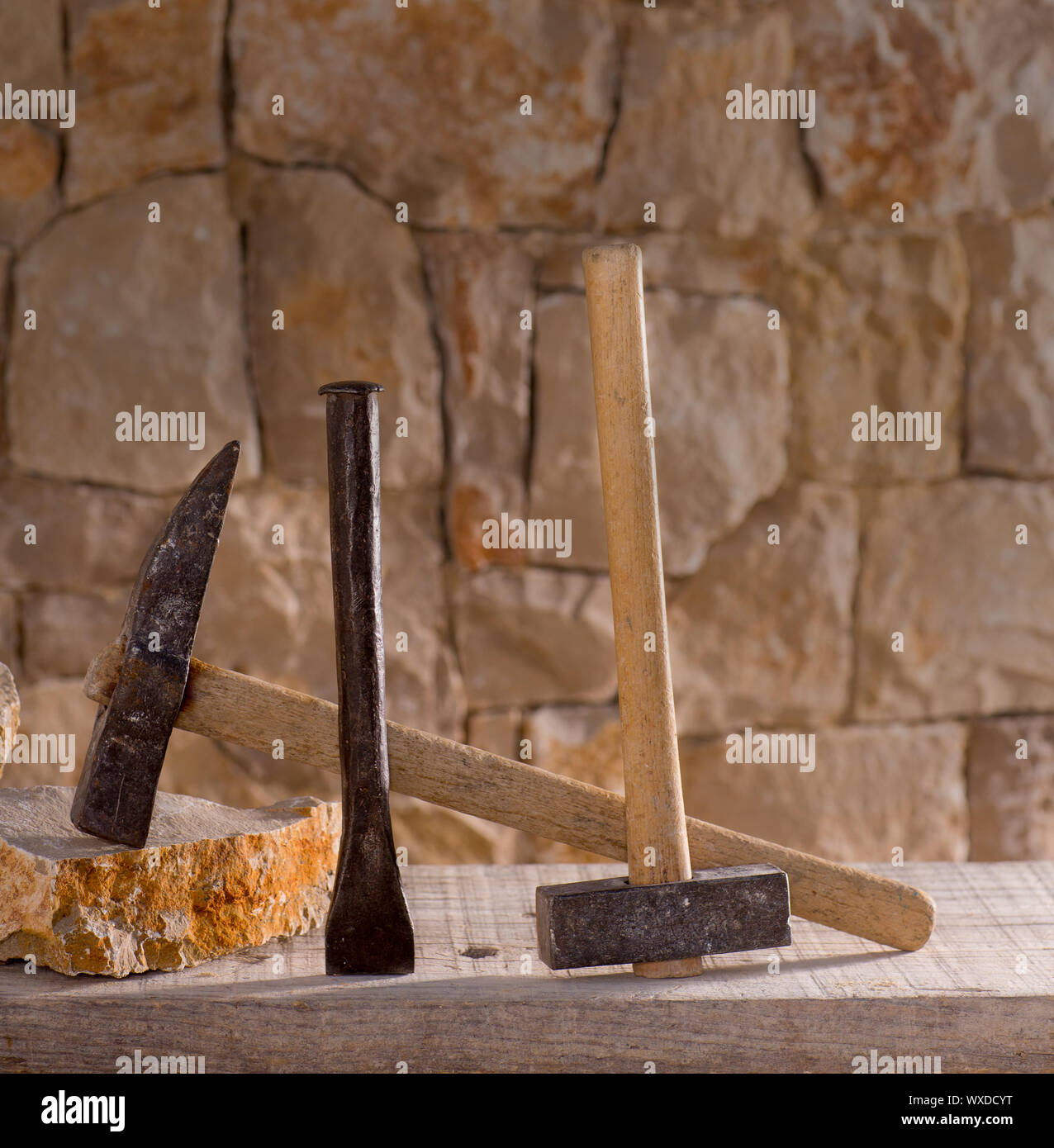 Hammer mason tools of stonecutter masonry work in a contruction stone wall Stock Photo Alamy